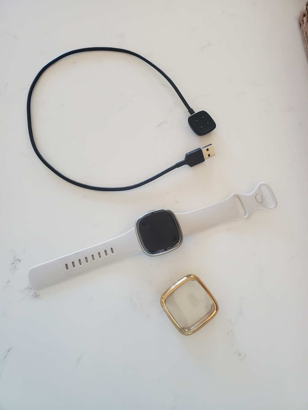 Fitbit Sense 2 smartwatch With Charger And Gold Screen Protector.